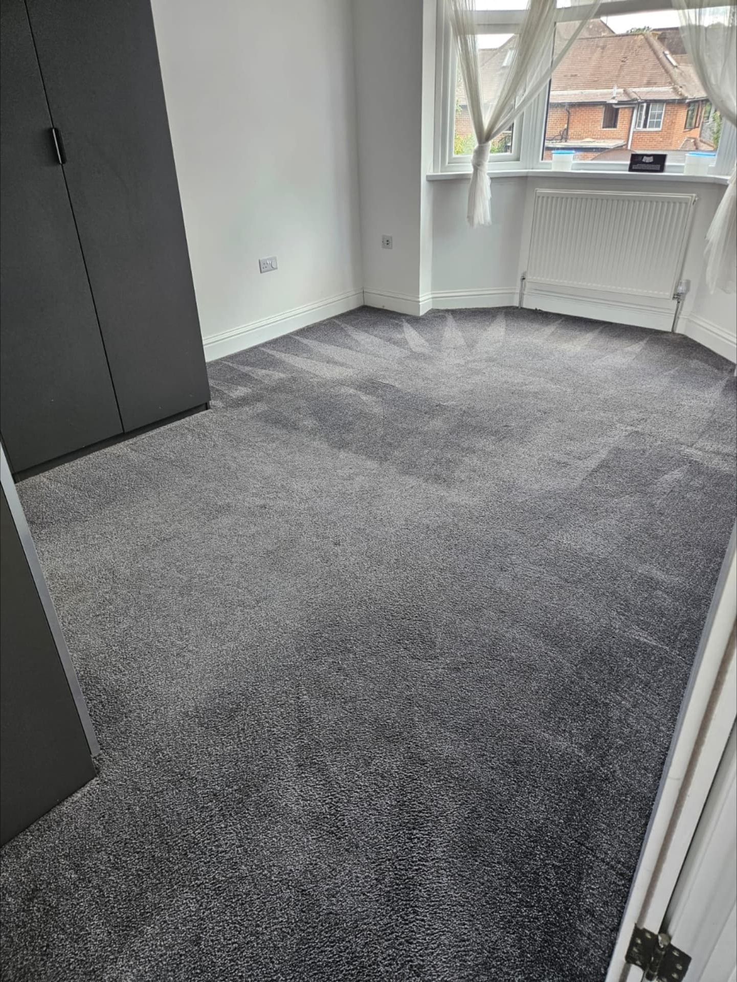 A bedroom carpet after professional carpet cleaning by Carpella